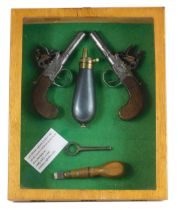 Two early 19thC flintlock muff pistols, by Rock & Sons, 15cm long, together with a turnkey, 7.5cm lo