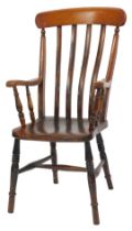 A late 19thC elm and beech lath back kitchen chair, with solid saddle seat on turned legs united by