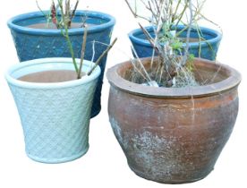Four garden plant pots, comprising two similar examples, in blue/green glaze, 37cm high and 33cm hig