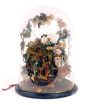 A late 19thC wax and material fruit centrepiece, formed as a still life with central nest and flower