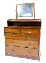 A 20thC oak mirror back dressing chest, stamped Gillows, the rectangular swing frame mirror above a