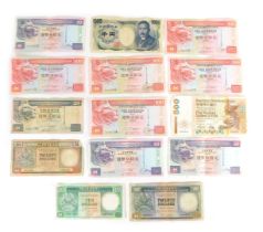 A group of 1990s and later banknotes, comprising 1,000 Yen, five 100 Hong Kong dollars, three 50 Hon