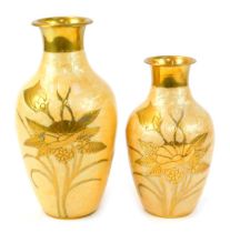 Two Oriental influence brass vases, of shouldered cylindrical tapering form with flared necks, decor