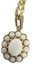 A 9ct gold and opal floral pendant and chain, the oval pendant set with an arrangement of oval and r