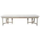 A 20thC Continental cream painted extending dining table, the rectangular rounded top with a moulded
