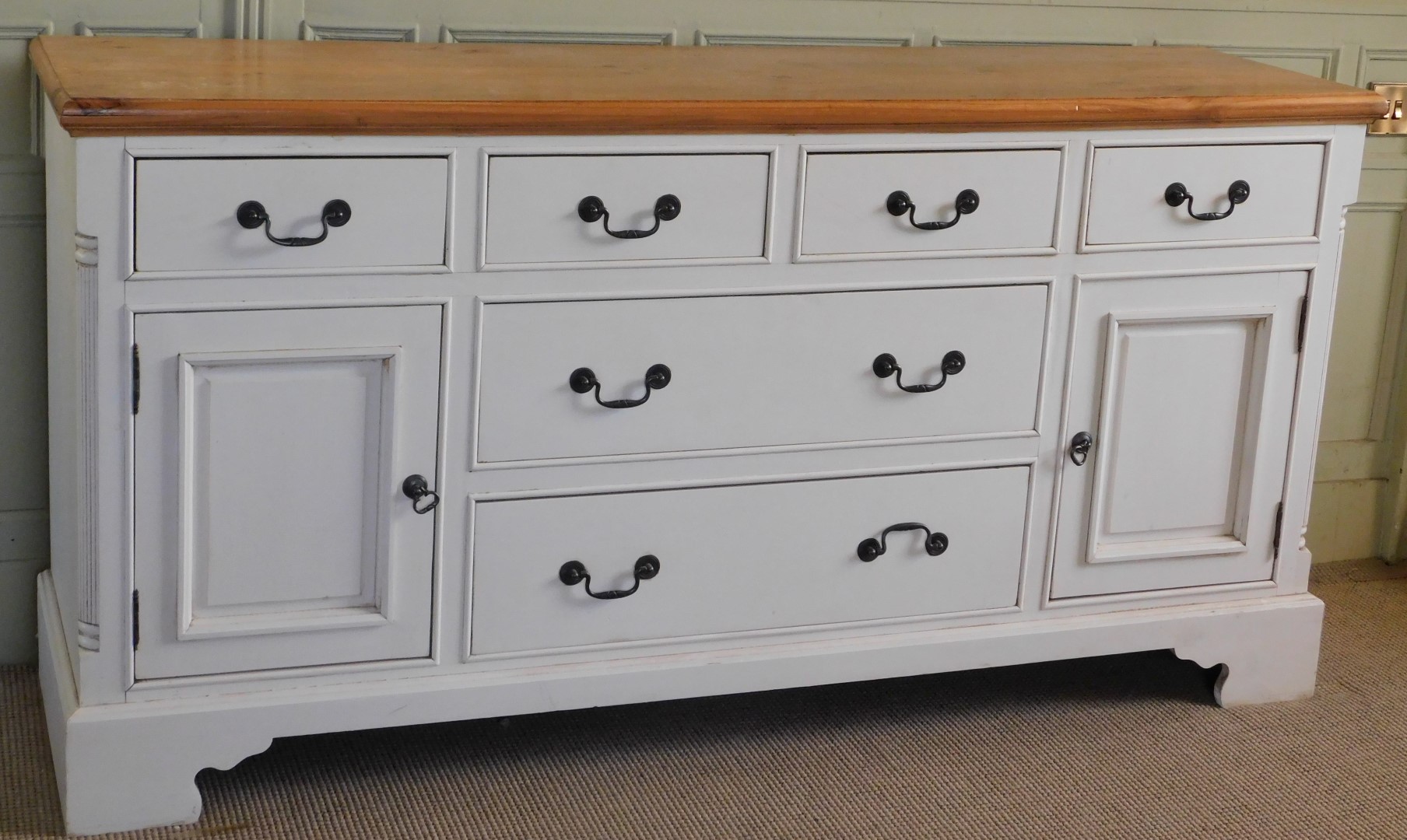 A modern pine and cream painted sideboard, the top with a moulded edge above four short drawers abov - Image 2 of 3