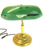 A 20thC brass desk lamp, with green glass shade on circular base, 29cm high.
