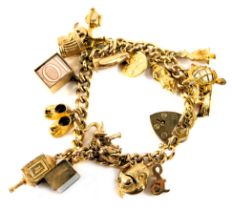 A curb link charm bracelet, with heart shaped padlock and safety chain, the links stamped 375, with