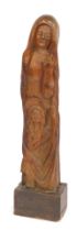 A 20thC hardwood primitive carving depicting Mother and Child, on rectangular base, 116cm high.