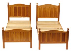 A pair of Horace Knightman Knight of Thirsk oak single bed frames, comprising head, foot and slatted