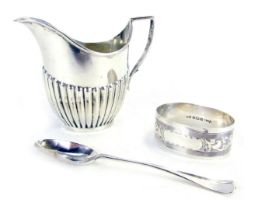 Three items of small silver, comprising a George V semi fluted milk jug, James Deakin & Sons, Sheffi