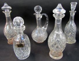 A group of cut glass decanters, comprising decanter of mallet form with stopper, 33cm high, two simi