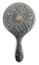 A George V silver hand mirror, with embossed floral decoration, Birmingham 1915.