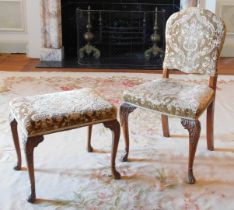 A walnut side chair in the Queen Anne style, with padded back, the seat upholstered in brown and bei