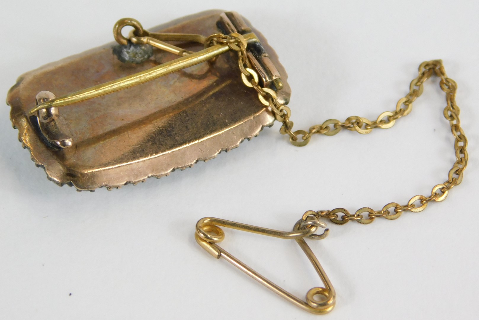 A Victorian memorial brooch, with rectangular window panel, inset plated lockets of hair, with seed - Image 2 of 2