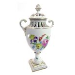 A mid 20thC Dresden porcelain two handled urn and cover, with pierced borders and decorated with flo