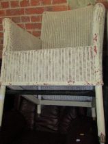 A painted wicker armchair.