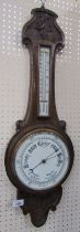 An oak cased banjo wall barometer, with circular opaque glass dial, 75cm high.