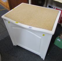 A white laundry box, the hinged lid inset with a corked panel, 52cm high, 49cm wide, 41cm deep.