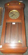 An oak cased wall clock, with Arabic numeral dial, eight day, 80cm high.