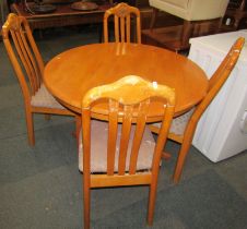 An oak dining table, the circular top on a turned column, with four out swept legs, 73cm high, the t