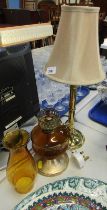 A brass table lamp base, with tapering shade, 50cm high overall, together with a brass oil lamp with