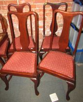 A set of four Queen Anne style dining chairs, each with a drop in seat.