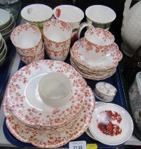 A Foley China part tea service, on the Autumnal Orange Leaf ground, three Kew Garden mugs, etc. (1 t