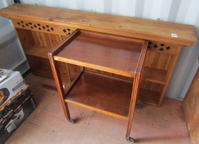 A pine hanging wall shelf, the moulded top above a pierced section, the base with two shelves suppor