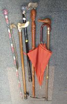 Various walking sticks, shoe horn, umbrella, etc. (a quantity)