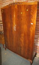 A mid century mahogany double wardrobe, 176cm high, 123cm wide, 45cm deep.