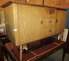 A mid century teak sideboard, the rectangular top above three drawers, flanked by cupboards, 84cm hi