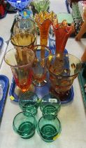 A group of coloured glass ware, to include green glass beakers, Carnival glass vases, etc.