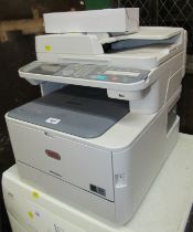 An Oki photocopy and printer, MC562W, together with a cartridge.