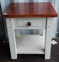 A bedside table, the top above a painted base, frieze drawer with under tier, on stiles, 59cm high,