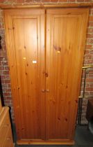 A pine double wardrobe, 178cm high, 84cm wide, 52cm deep.