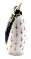 A Royal Crown Derby porcelain penguin, lacking gold button, red back stamp.