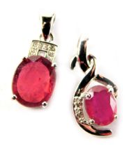 Two ruby and diamond pendants, each set in white metal stamped 925, one with certificate for Madagas