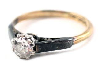 A diamond solitaire ring, the old cut diamond approx 0.12ct, in claw setting, on white metal shoulde