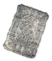 A Victorian silver card case, engraved with scrolls, acanthus leaves and various geometric devices,