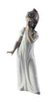 A Nao porcelain figure of a yawning young girl, in a nightdress, 30cm high, boxed.