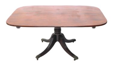 An early 19thC mahogany tilt top table, the rectangular top with rounded corners and a moulded edge