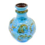 A German fat lava bottle shaped vase, decorated with shells, etc., in shades of blue, green and brow