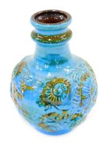 A German fat lava bottle shaped vase, decorated with shells, etc., in shades of blue, green and brow