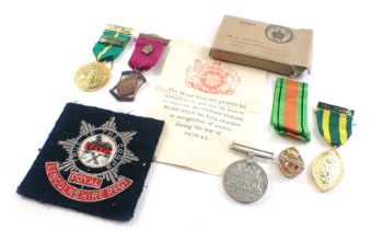 Various medals and badges, comprising a 1939-45 Defence medal, a Mr H Peckers medal box with ribbon,