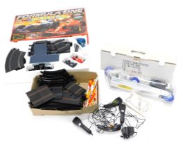 A Scalextric Formula 1 slot car racing set, boxed, another part set, and a scooter. (3)