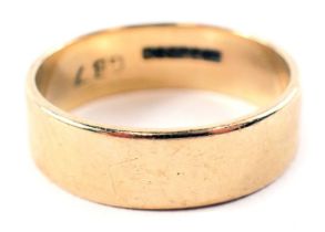 A 9ct gold wedding band, of plain design, inscribed GB7, ring size U, 5.7g.