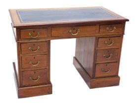 A late 19th/early 20thC mahogany pedestal desk, the rectangular top inset with blue leather, above a
