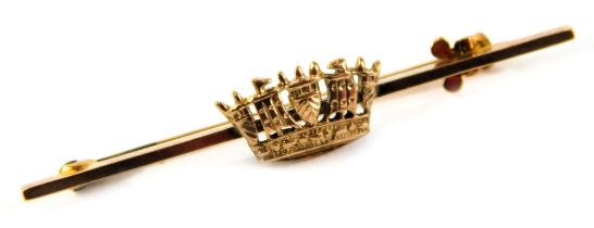 A bar brooch, set with central crown, on fine link pin, yellow metal stamped 9ct, 4cm wide, 2.2g all