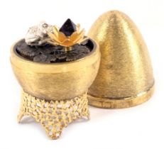 A Stuart Devlin silver parcel gilt frog and lily pad egg , London 1972, with unmarked silver gilt co